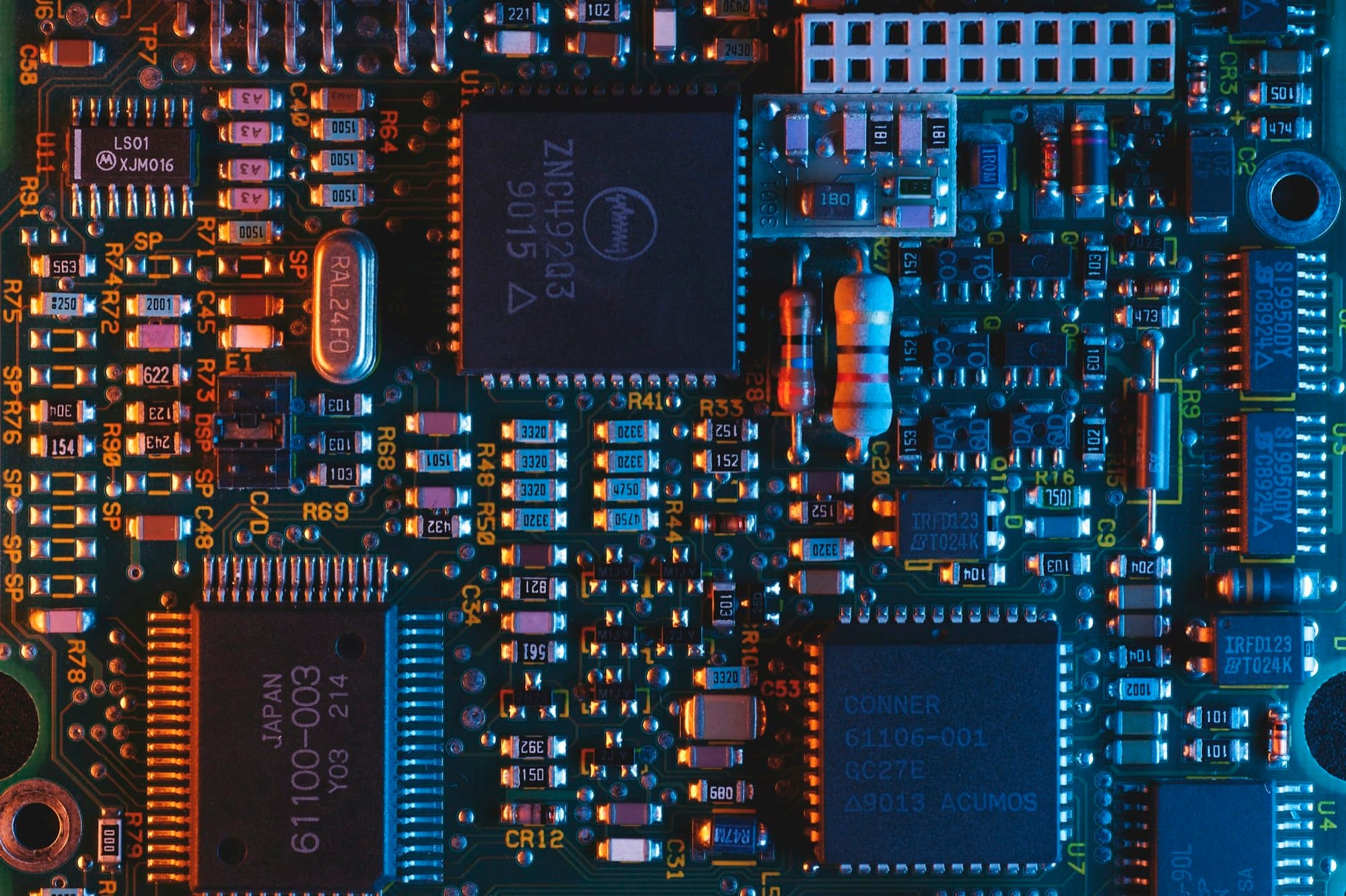Populated circuit board with surface-mount ICs, resistors, capacitors, crystal and pin header